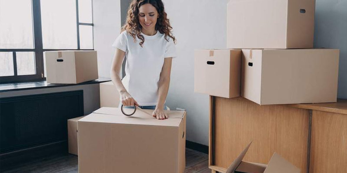 woman-packs-moving-boxes